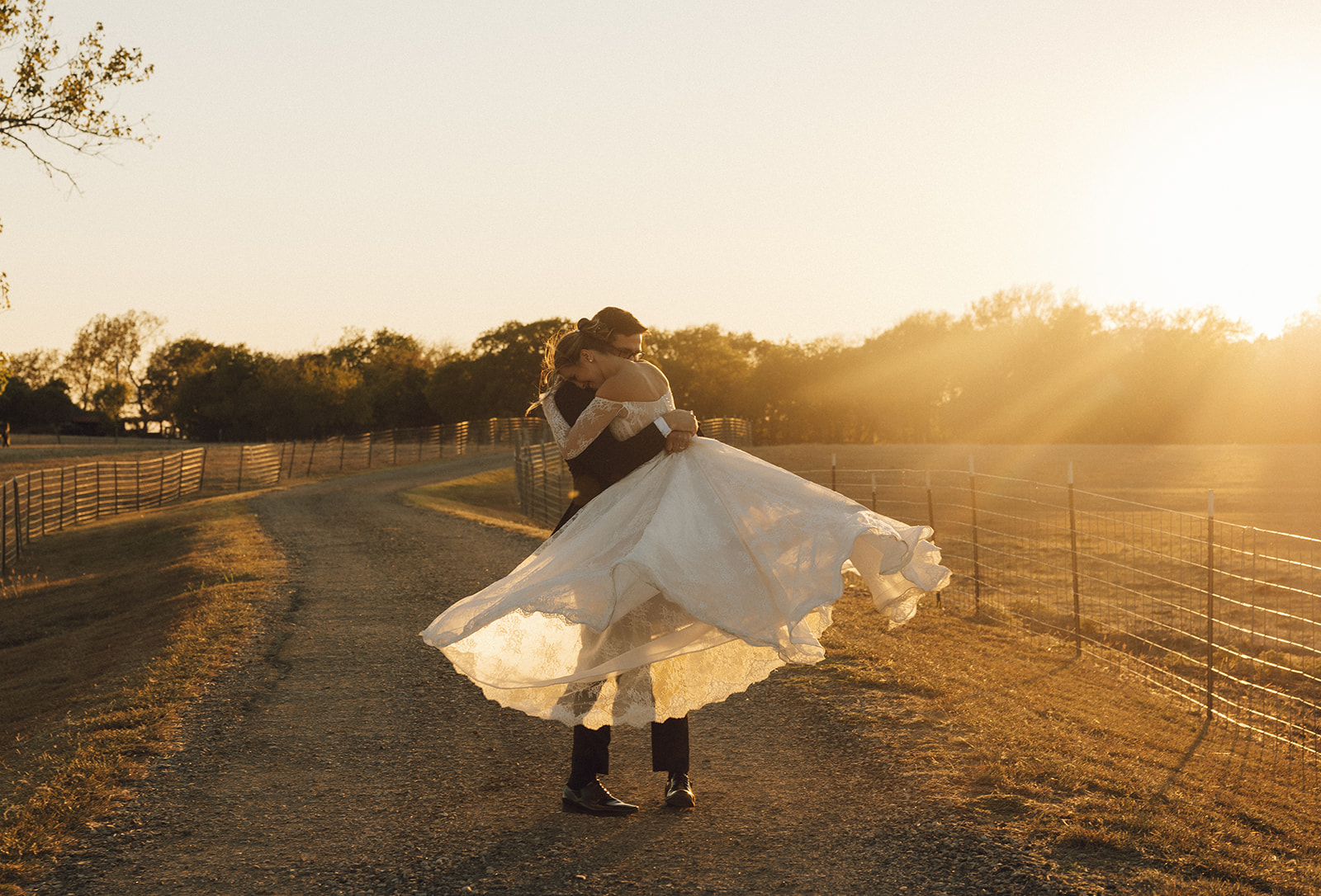 A bride and groom twirl in the golden hour light at their bridal portraits in Farmersville, Texas.