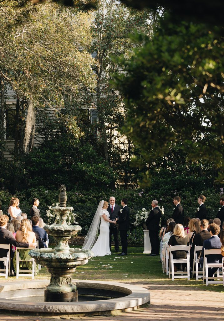 Garden wedding ceremony under the old oaks at the Governor Thomas Bennett House in Charleston